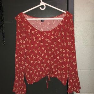 Off the shoulder super cute and unique shirt.